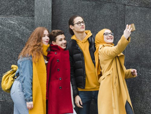 group-happy-teenagers-taking-selfie-together